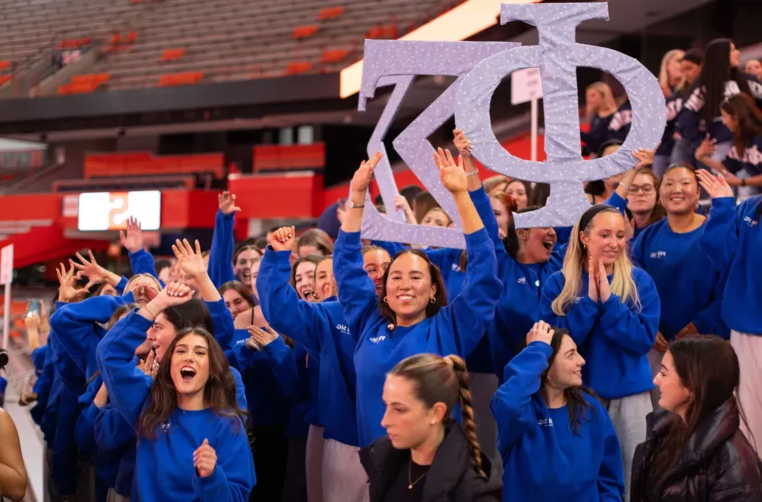 Phi Sigma Sigma students cheering at Pan Hellenic kickoff.